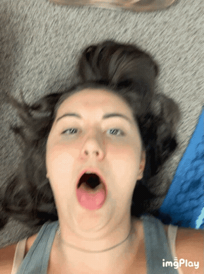 Woman Laying On Floor With Mouth Open GIF
