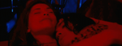 Woman Laying On Man's Chest In Red Light GIF