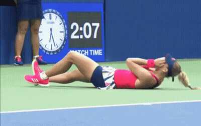 Woman Laying On Tennis Court With Clock 2:07 GIF