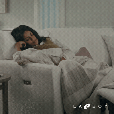 Woman Laying On White Couch Lazy Mode GIF