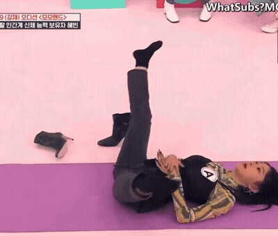 Woman Laying on Yoga Mat Saying Whatsubs