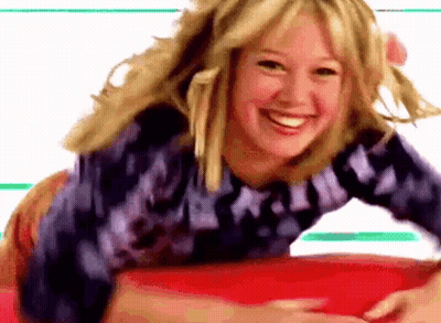 Woman Laying Smiling On Red Surface GIF