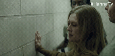 Woman Leaning Against Brick Wall GIF