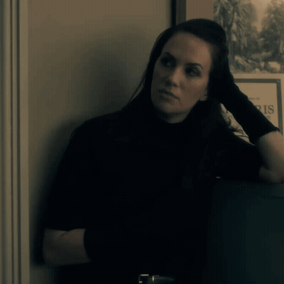 Woman Leaning Against Wall Saying Paris GIF