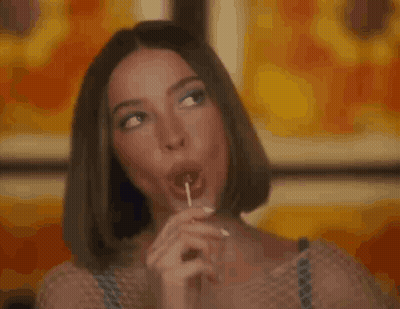 Woman Licking Lollipop GIF