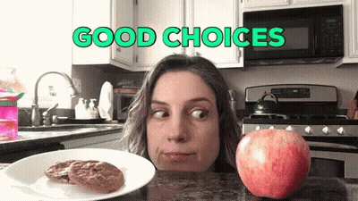 Woman Looking At Apple And Cookies Good Choices GIF