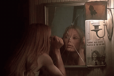 Woman Looking At Broken Mirror With Tommy Boss Picture GIF
