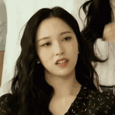 Woman Looking At Camera With Long Black Hair GIF