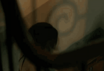 Woman Looking At Herself In Mirror GIF