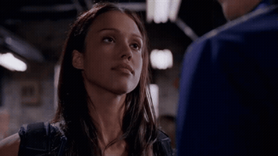 Woman Looking At Man In Dark Room GIF