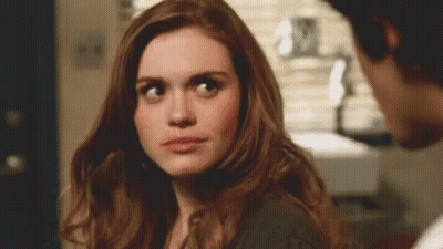 Woman Looking At Man In Room GIF