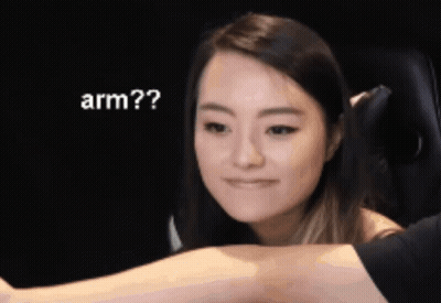 Woman Looking At Man's Arm Saying Arm GIF