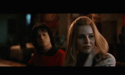 Woman Looking At Man Sitting Together GIF