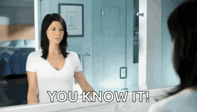 Woman Looking At Mirror Saying You Know It GIF