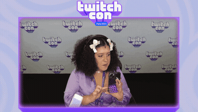 Woman Looking At Phone At Twitch Con GIF