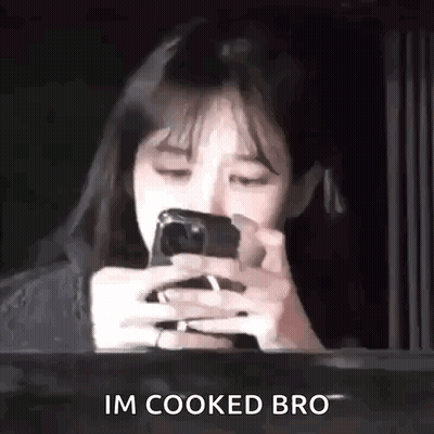 Woman Looking At Phone Saying I'm Cooked Bro GIF