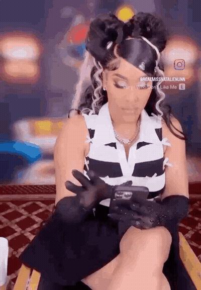 Woman Looking At Phone Wearing Gloves GIF