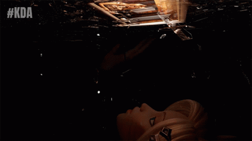 Woman Looking At Reflection In Broken Mirror GIF