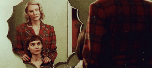 Woman Looking At Reflection In Mirror GIF