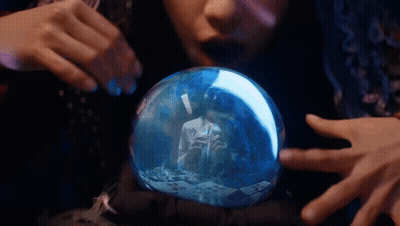 Woman Looking At Snow Globe With Man Reflection GIF