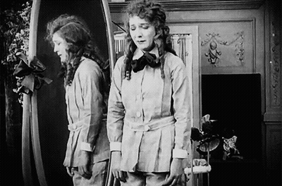 Woman Looking In Mirror GIF