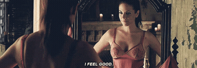 Woman Looking In Mirror Saying I Feel Good GIF