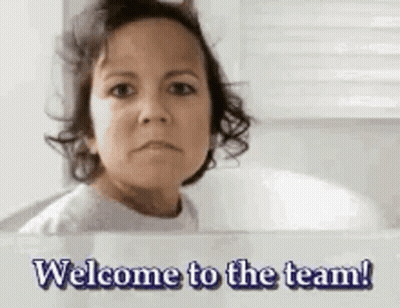 Woman Looking In Mirror Saying Welcome To The Team GIF