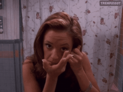 Woman Looking In Mirror With Trendizsst GIF