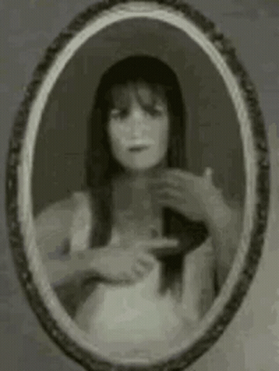 Woman Looking In Mirror GIF