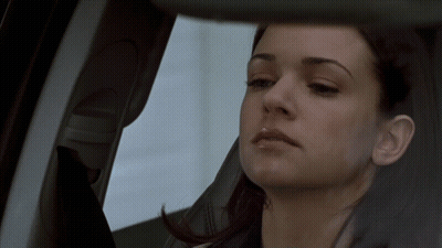 Woman Looking Out Car Window GIF