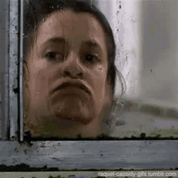 Woman Looking Out The Window GIF