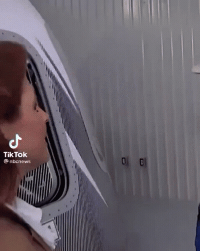 Woman Looking Out Window Man Behind GIF