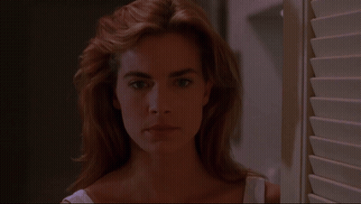 Woman Looking Out Window GIF