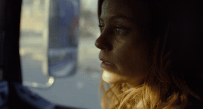 Woman Looking Out Window