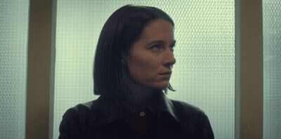Woman Looking Out Window With Grid GIF