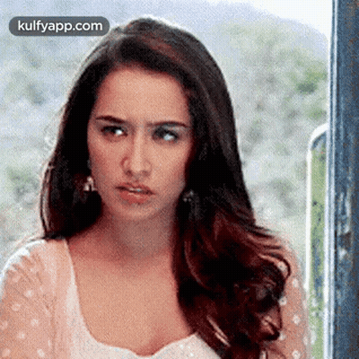 Woman Looking Out Window GIF