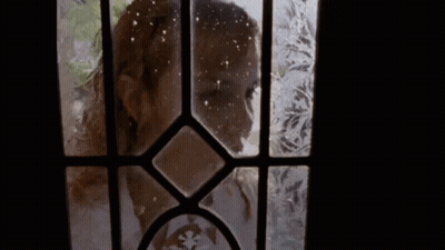 Woman Looking Through Frosted Glass Door GIF