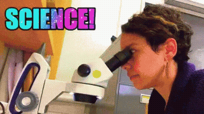 Woman Looking Through Microscope Saying Science GIF