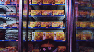 Woman Looking Through Refrigerator Full Of Eggs And Waffles GIF