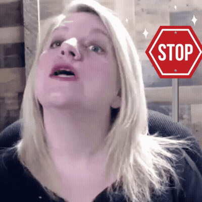 Woman Looking Up At Stop Sign GIF