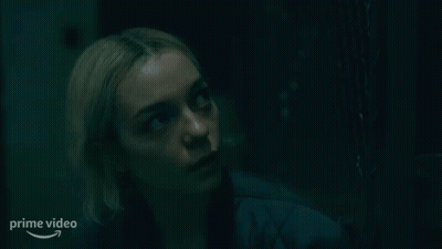 Woman Looking Up In Dark Room GIF