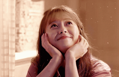 Woman Looking Up With Hands On Face GIF