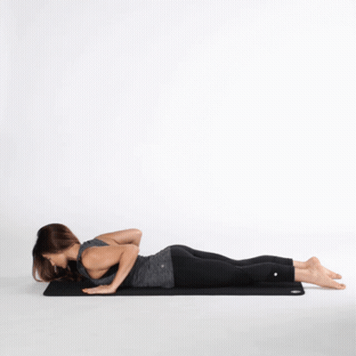 Woman Lying Cross-Legged On Yoga Mat GIF