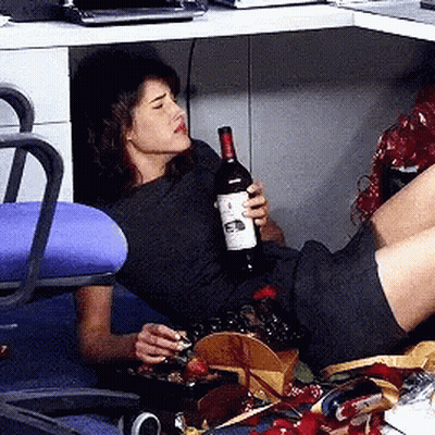 Woman Lying Holding Wine Bottle Labeled A GIF