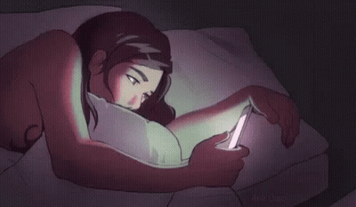 Woman Lying In Bed Looking At Cell Phone GIF