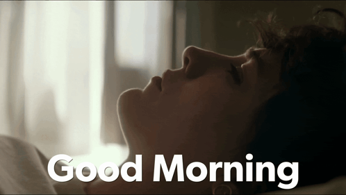 Woman Lying in Bed Saying Good Morning