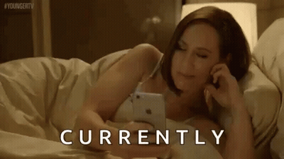 Woman Lying In Bed Talking On Phone GIF