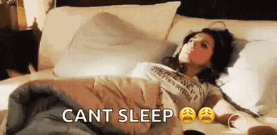 Woman Lying In Bed With Headphones GIF