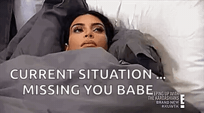 Woman Lying In Bed With Missing You Text GIF