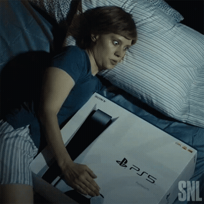 Woman Lying In Bed With PS5 Box GIF
